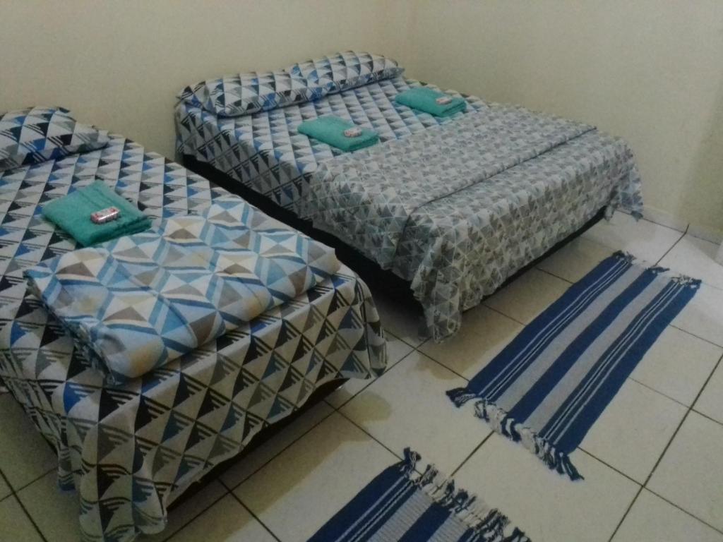 Postel nebo postele na pokoji v ubytování Pousada Jasmim Paraty