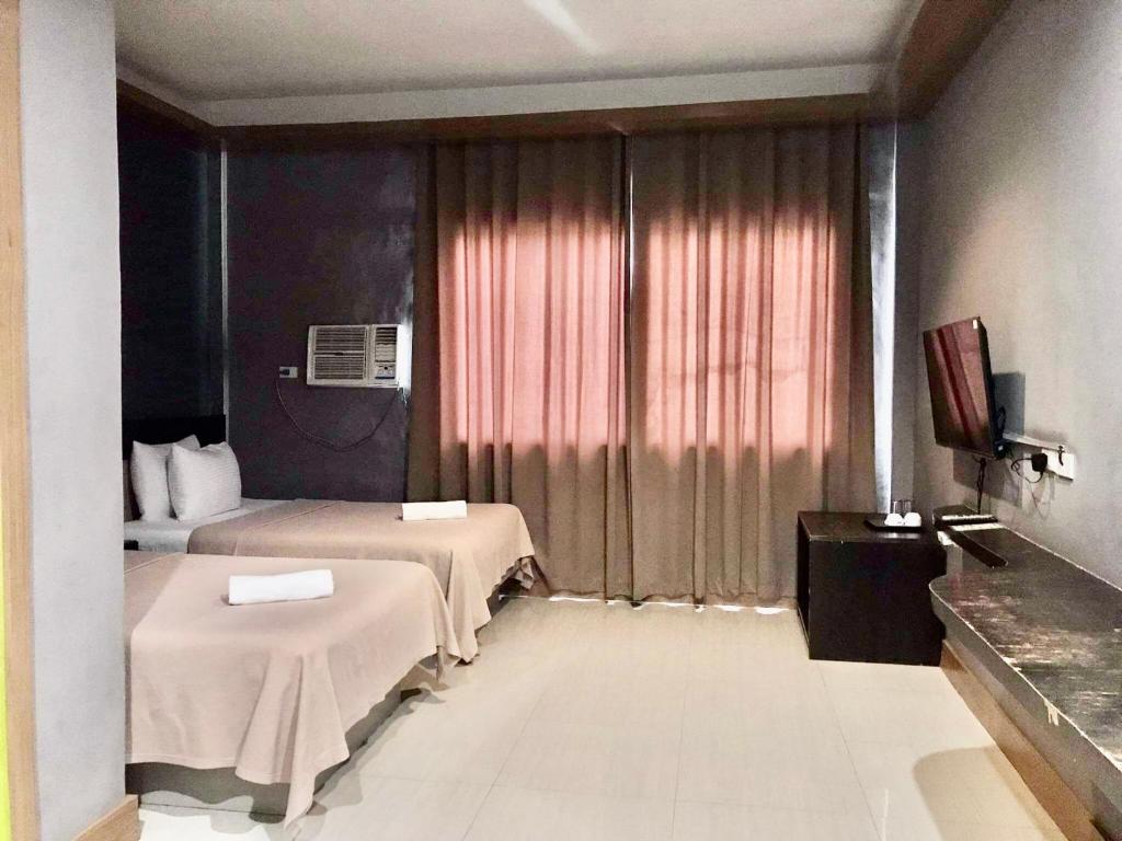 TV a/nebo společenská místnost v ubytování LEUX Hotel Alona Panglao