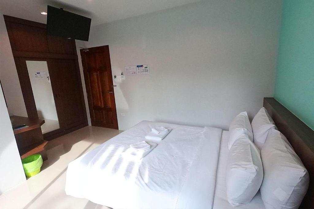 Postel nebo postele na pokoji v ubytování Friendly Hotel Krabi