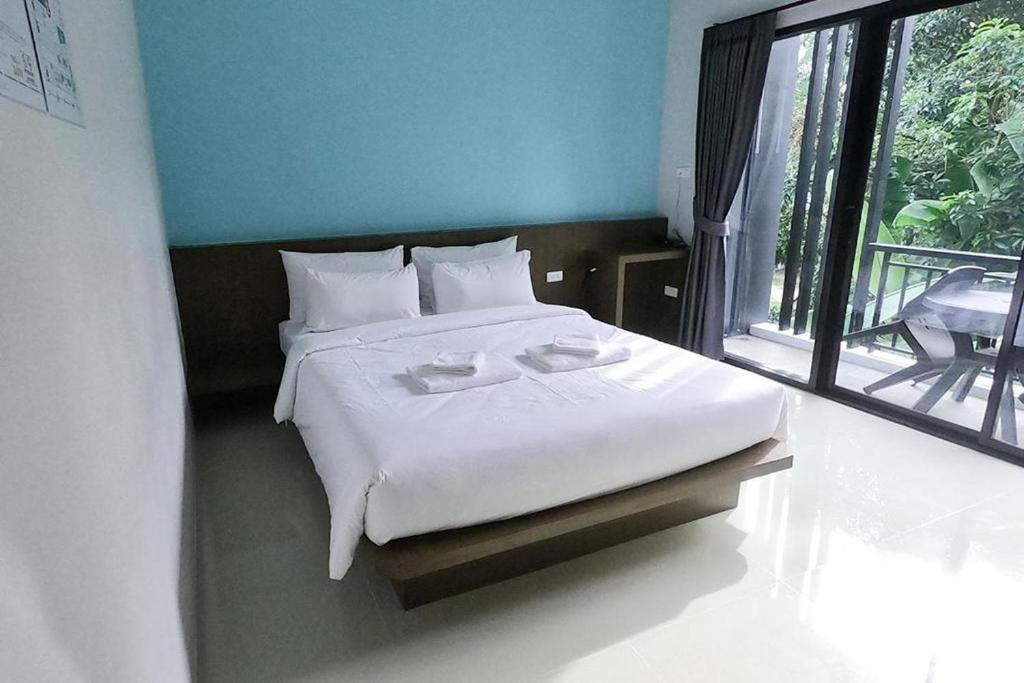 Postel nebo postele na pokoji v ubytování Friendly Hotel Krabi