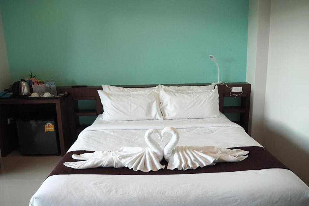 Postel nebo postele na pokoji v ubytování Friendly Hotel Krabi