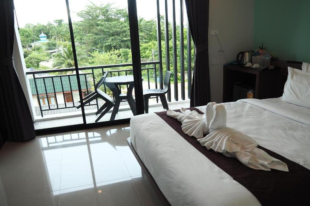 Postel nebo postele na pokoji v ubytování Friendly Hotel Krabi