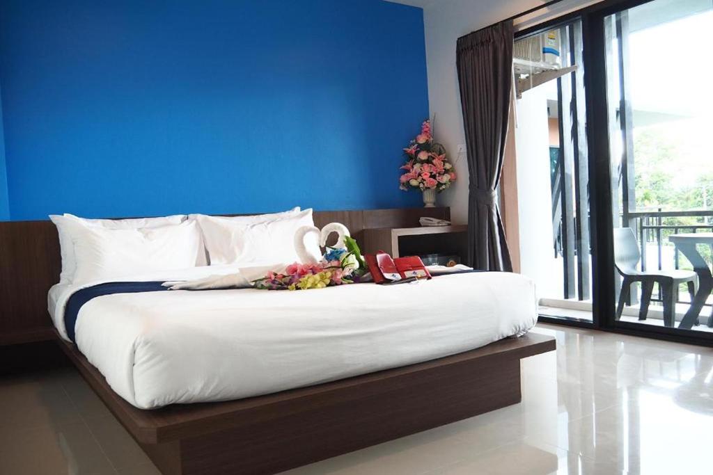 Postel nebo postele na pokoji v ubytování Friendly Hotel Krabi