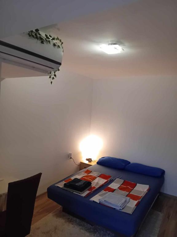 A bed or beds in a room at Park View Apartment Plovdiv with Parking