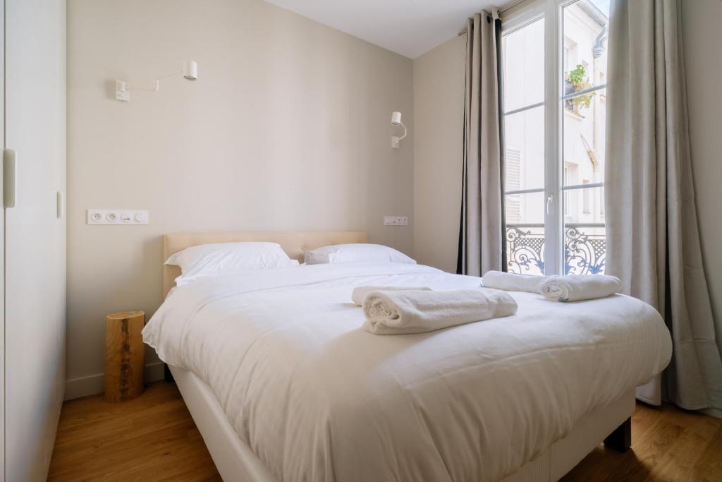 Posteľ alebo postele v izbe v ubytovaní Stunning 1 Bedroom Apartment in Paris
