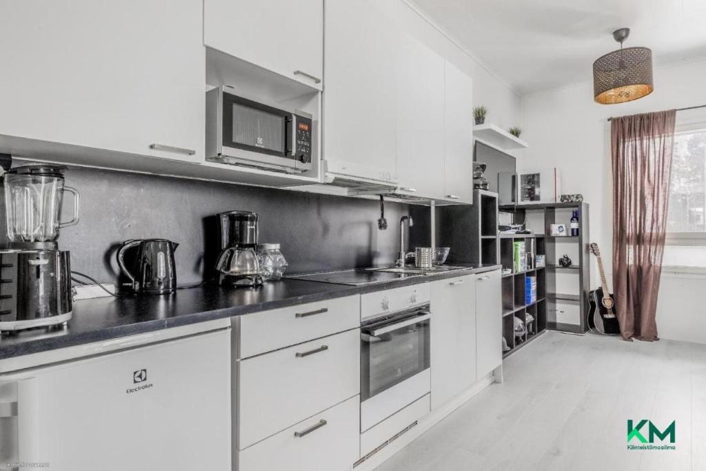 Dapur atau dapur kecil di Cozy apartment with BBQ