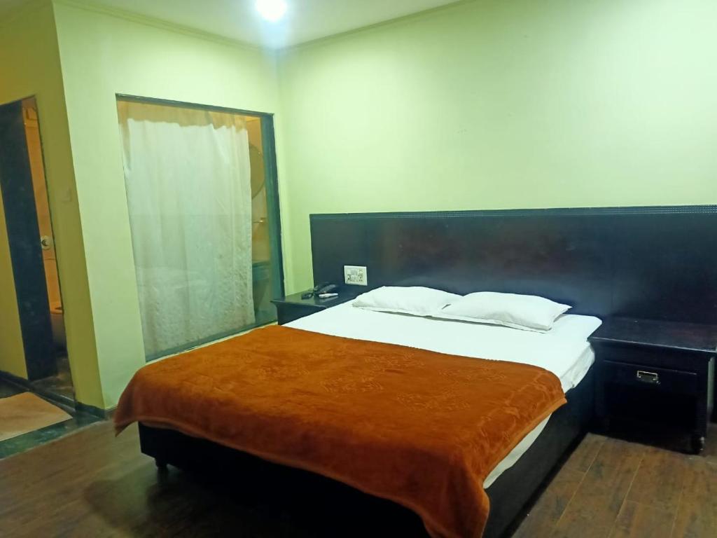 Postel nebo postele na pokoji v ubytování Hotel Skylark