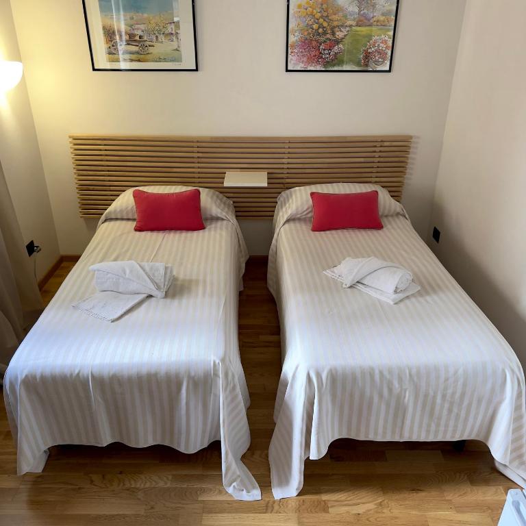 Postel nebo postele na pokoji v ubytování Hotel Quadrifoglio