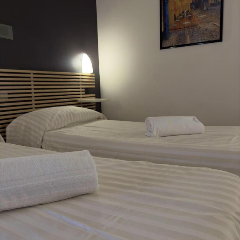 Postel nebo postele na pokoji v ubytování Hotel Quadrifoglio