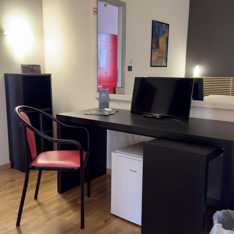 Kuchyň nebo kuchyňský kout v ubytování Hotel Quadrifoglio
