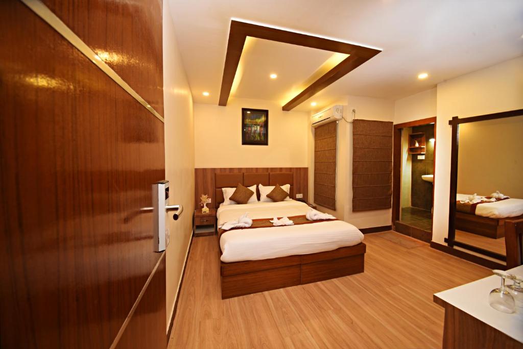 Postel nebo postele na pokoji v ubytování Capital Boutique Hotel