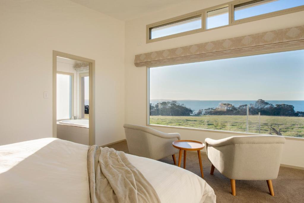 Postel nebo postele na pokoji v ubytování Oceanview Eco Villas
