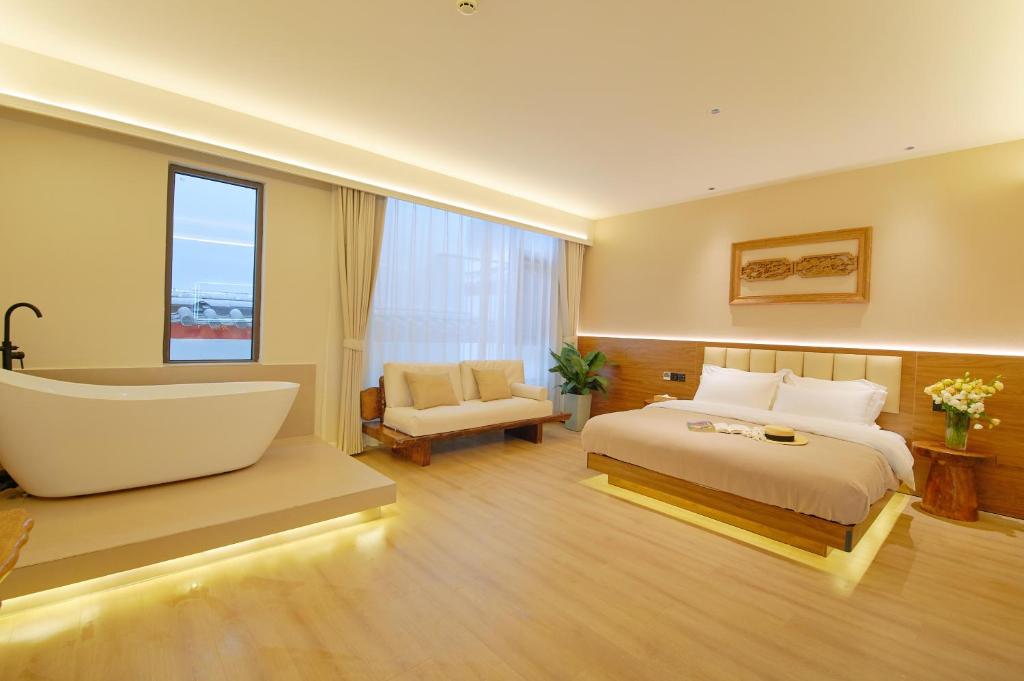Postel nebo postele na pokoji v ubytování 夕露小榭南门机场大巴店Xiluxiaoxie MUXIN INN