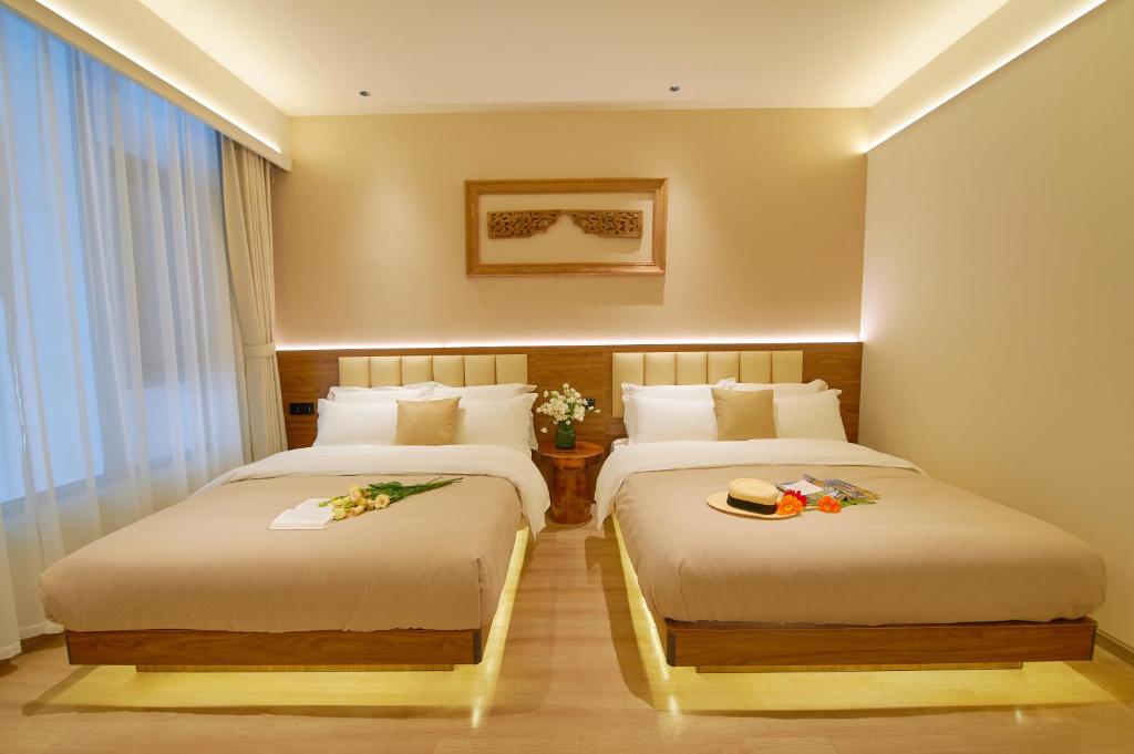 Postel nebo postele na pokoji v ubytování 夕露小榭南门机场大巴店Xiluxiaoxie MUXIN INN