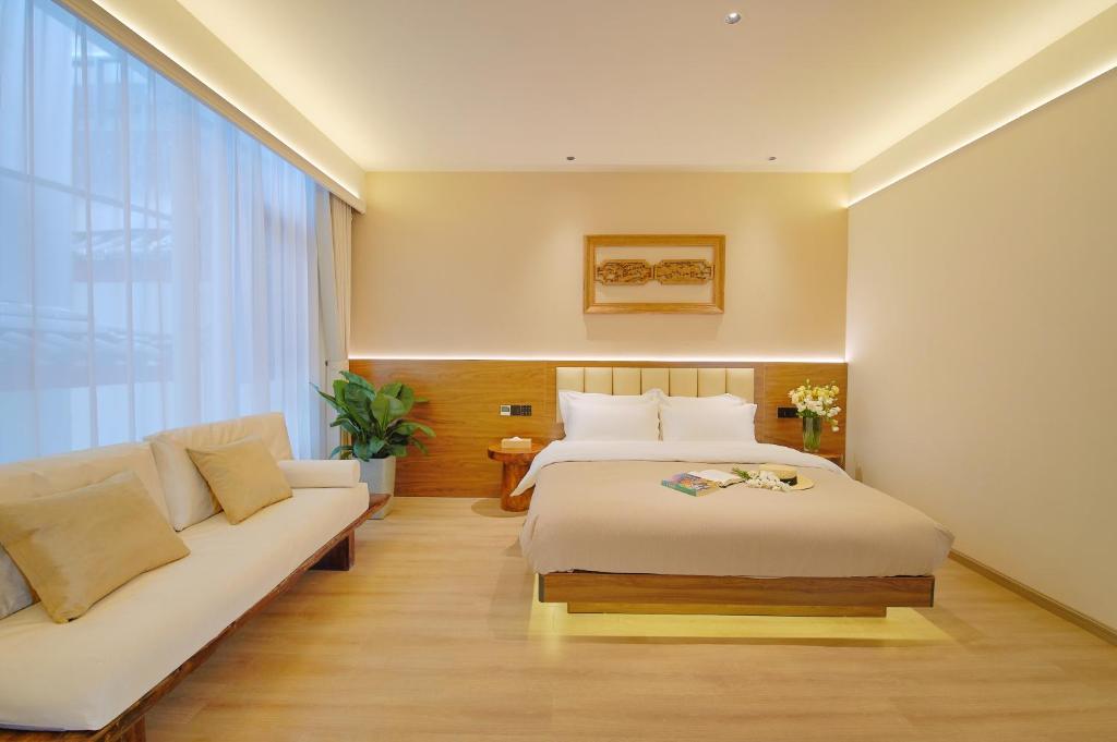 Postel nebo postele na pokoji v ubytování 夕露小榭南门机场大巴店Xiluxiaoxie MUXIN INN