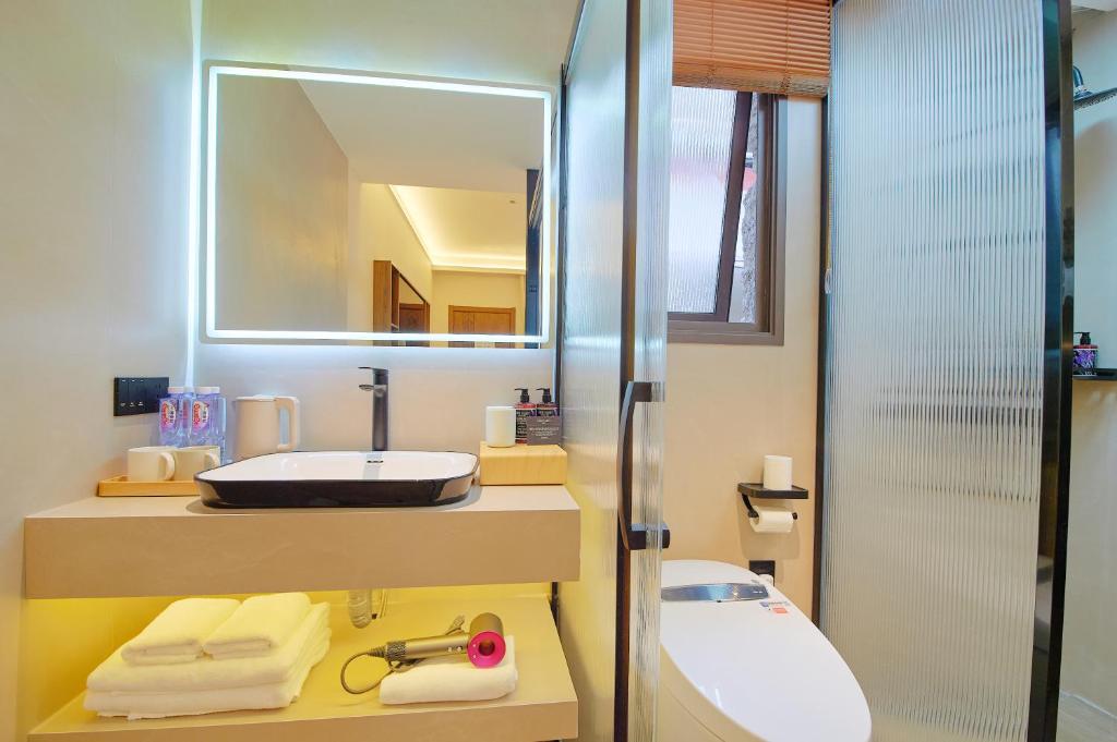 Koupelna v ubytování 夕露小榭南门机场大巴店Xiluxiaoxie MUXIN INN