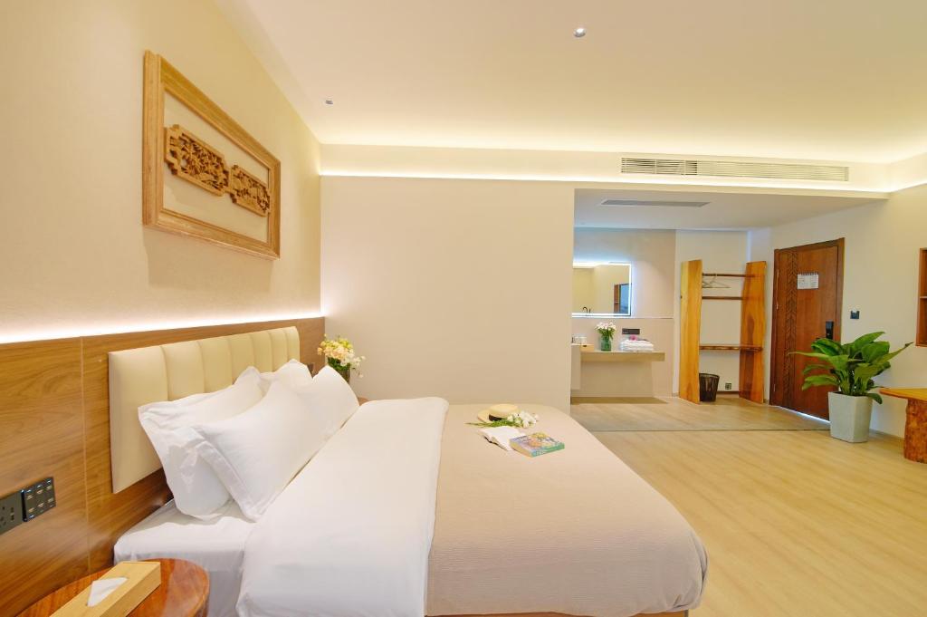 Postel nebo postele na pokoji v ubytování 夕露小榭南门机场大巴店Xiluxiaoxie MUXIN INN