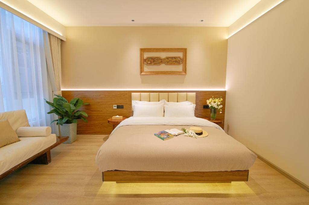 Postel nebo postele na pokoji v ubytování 夕露小榭南门机场大巴店Xiluxiaoxie MUXIN INN