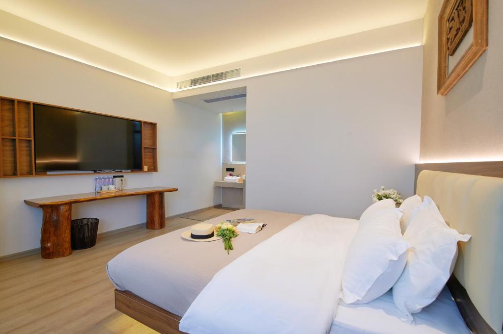 Postel nebo postele na pokoji v ubytování 夕露小榭南门机场大巴店Xiluxiaoxie MUXIN INN