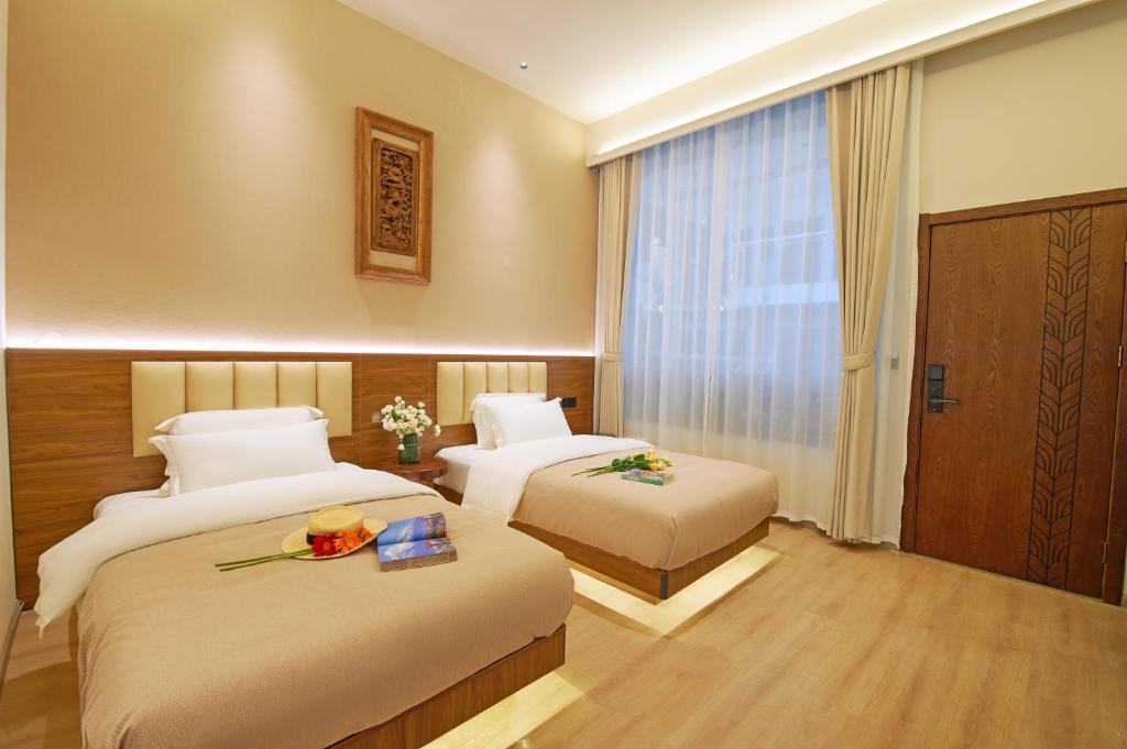 Postel nebo postele na pokoji v ubytování 夕露小榭南门机场大巴店Xiluxiaoxie MUXIN INN