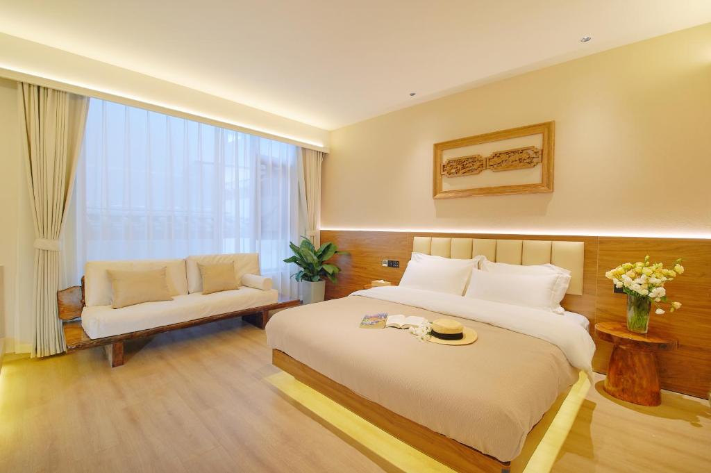 Postel nebo postele na pokoji v ubytování 夕露小榭南门机场大巴店Xiluxiaoxie MUXIN INN