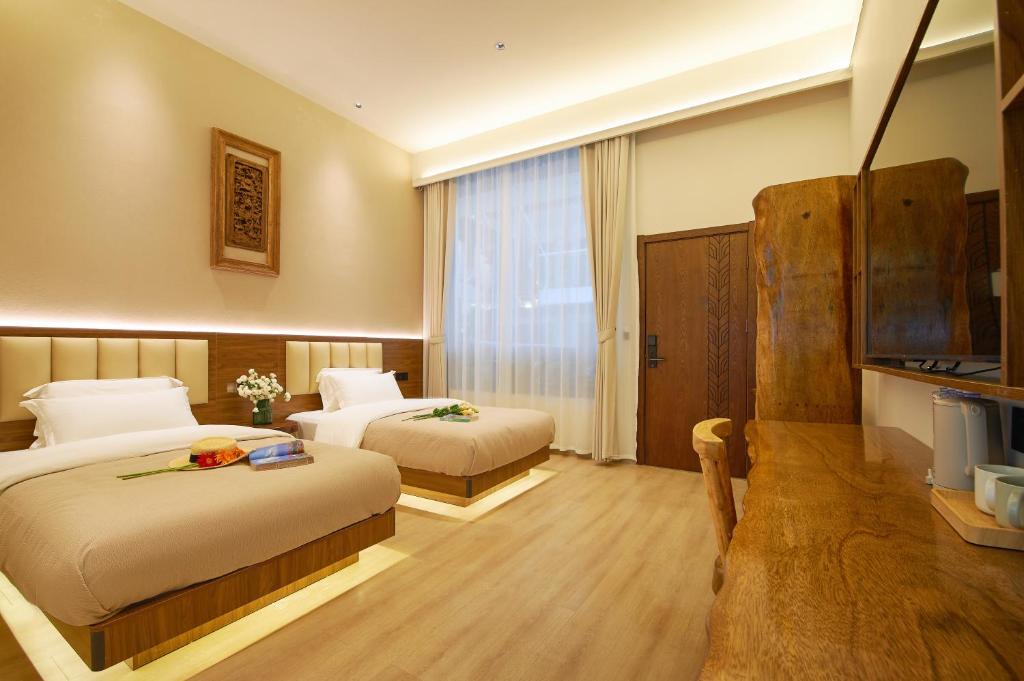Postel nebo postele na pokoji v ubytování 夕露小榭南门机场大巴店Xiluxiaoxie MUXIN INN
