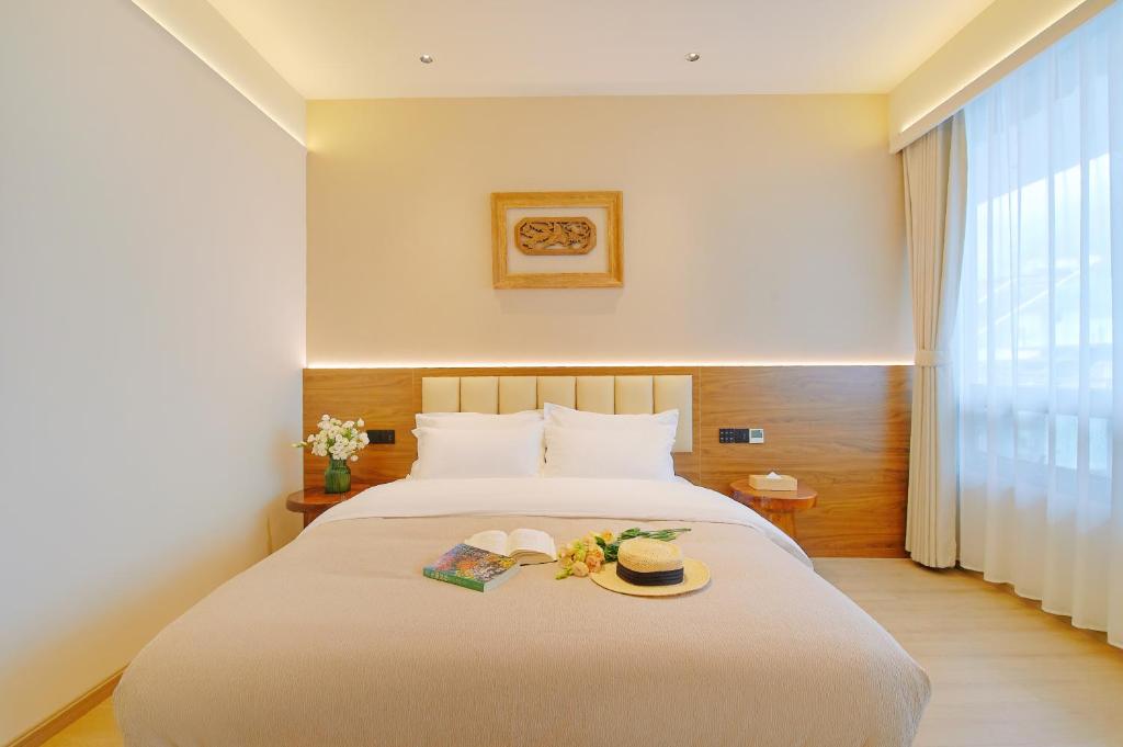 Postel nebo postele na pokoji v ubytování 夕露小榭南门机场大巴店Xiluxiaoxie MUXIN INN