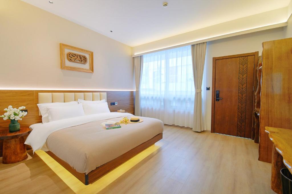 Postel nebo postele na pokoji v ubytování 夕露小榭南门机场大巴店Xiluxiaoxie MUXIN INN