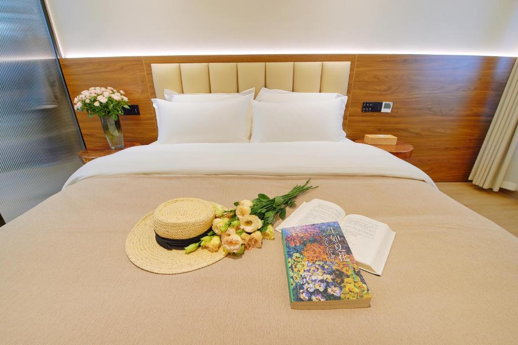Postel nebo postele na pokoji v ubytování 夕露小榭南门机场大巴店Xiluxiaoxie MUXIN INN