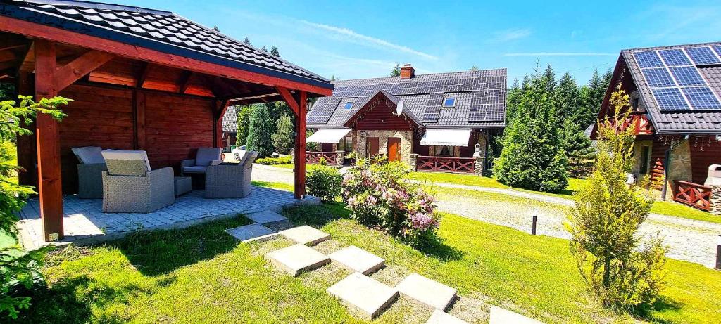 Vonkajšia záhrada v ubytovaní Ośrodek Wczasowy Na Borach