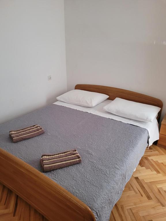 Postel nebo postele na pokoji v ubytování Apartments Nina