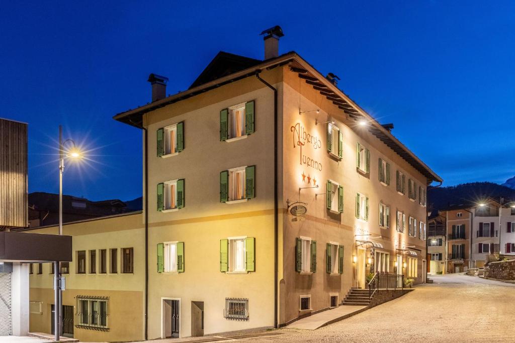 a building in a city at night at Albergo Tuenno in Tuenno