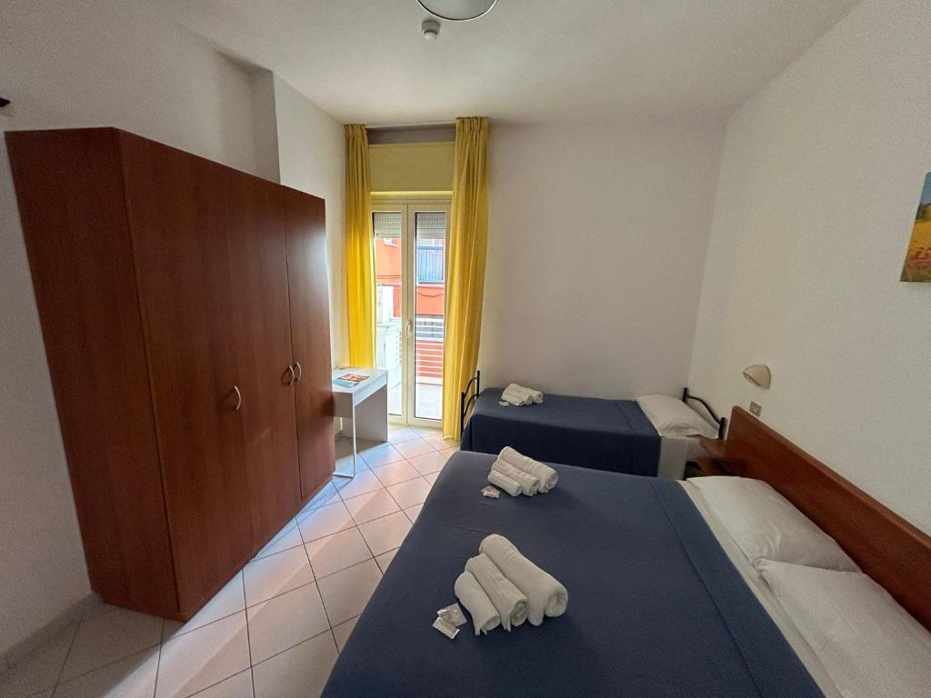 Postel nebo postele na pokoji v ubytování Hotel Sissi
