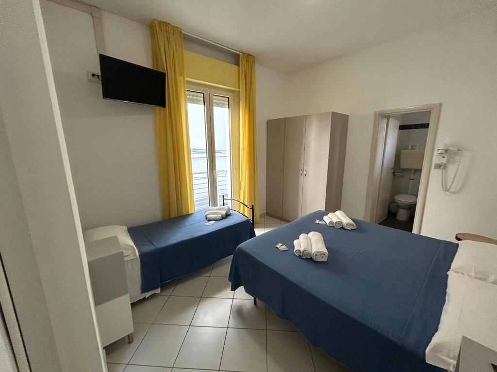 Postel nebo postele na pokoji v ubytování Hotel Sissi