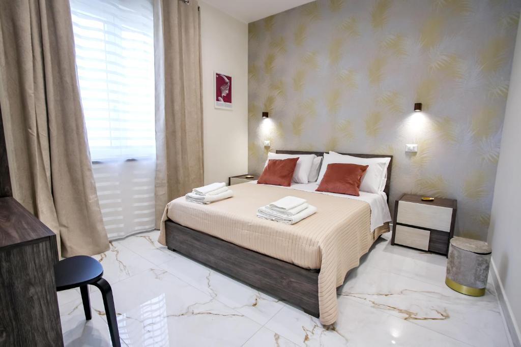 Ένα ή περισσότερα κρεβάτια σε δωμάτιο στο Lilì Apartments
