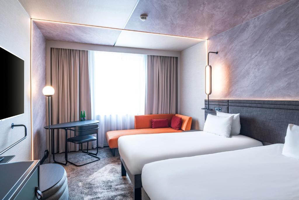 Postel nebo postele na pokoji v ubytování Novotel Praha Wenceslas Square