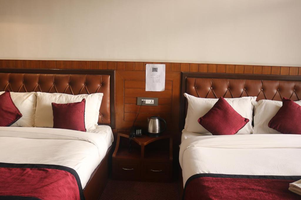 Postel nebo postele na pokoji v ubytování Hotel de Universal
