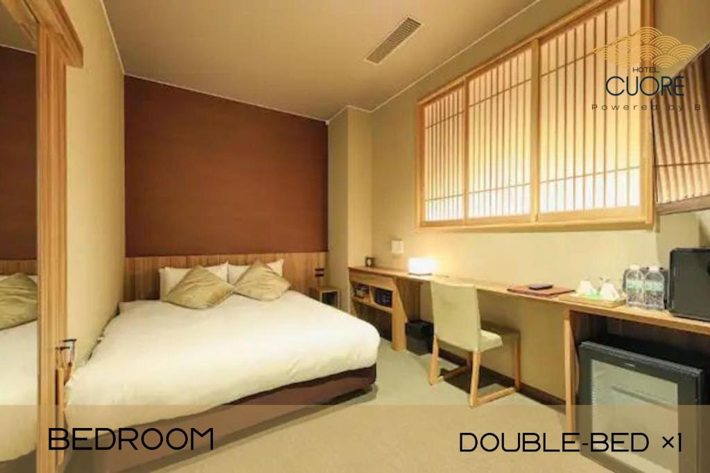 Postel nebo postele na pokoji v ubytování HOTEL CUORE Kyoto Shijo Omiya