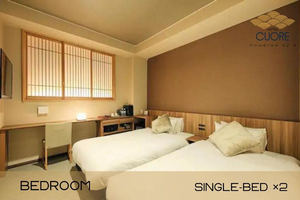 Postel nebo postele na pokoji v ubytování HOTEL CUORE Kyoto Shijo Omiya