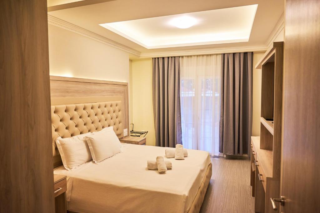 Posteľ alebo postele v izbe v ubytovaní Famissi Eden Hotel