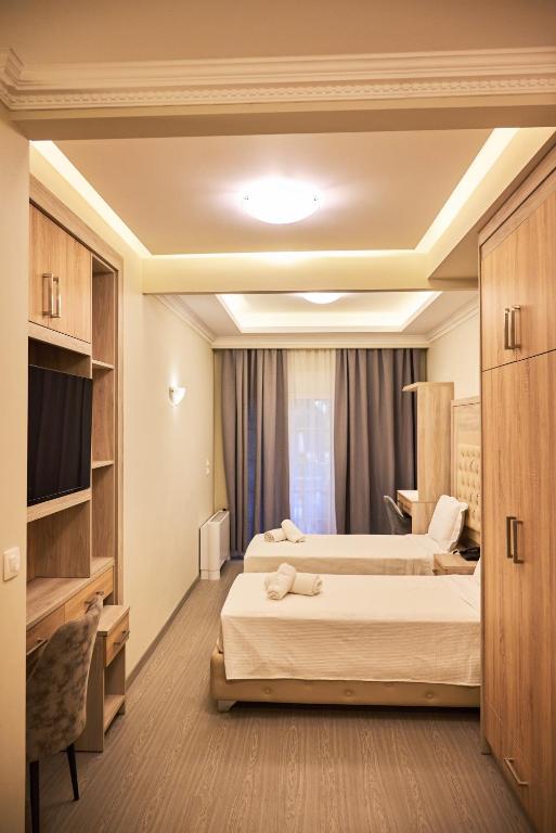 Posteľ alebo postele v izbe v ubytovaní Famissi Eden Hotel