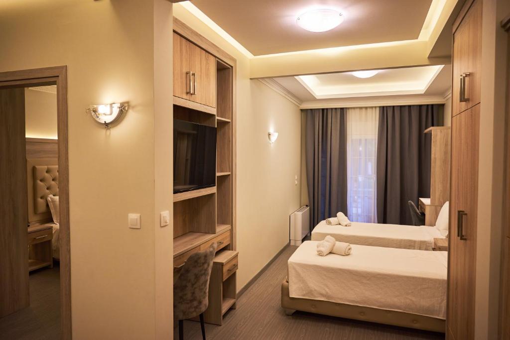 Posteľ alebo postele v izbe v ubytovaní Famissi Eden Hotel