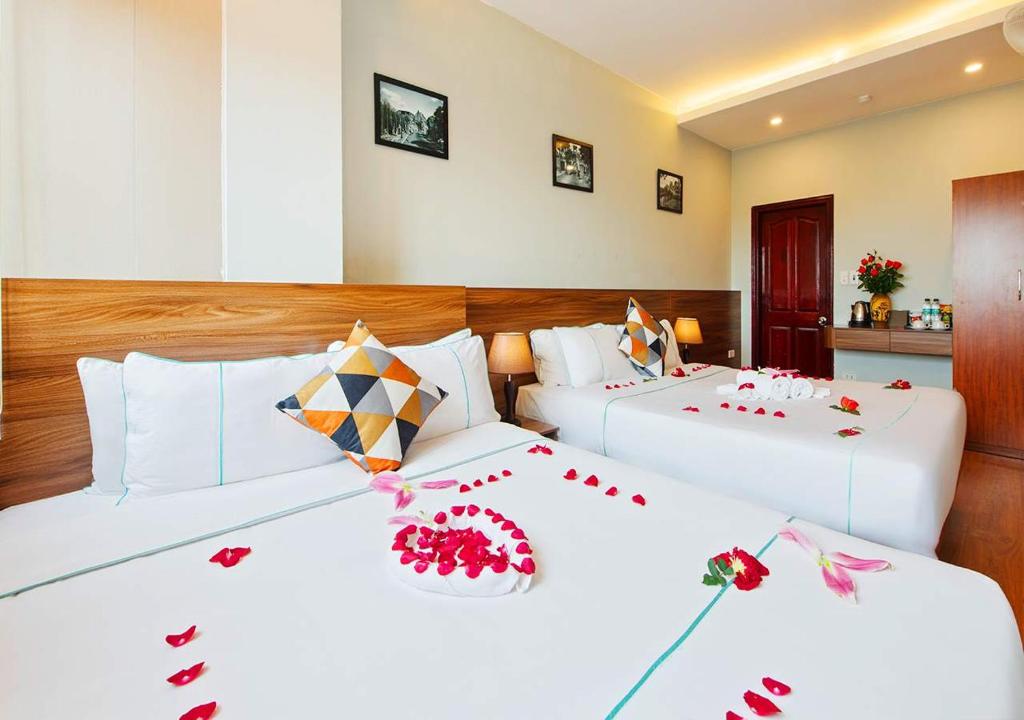 Postel nebo postele na pokoji v ubytování Hanoi Old Quarter Hotel