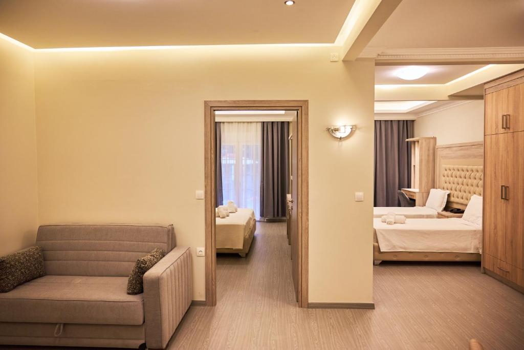 Posteľ alebo postele v izbe v ubytovaní Famissi Eden Hotel