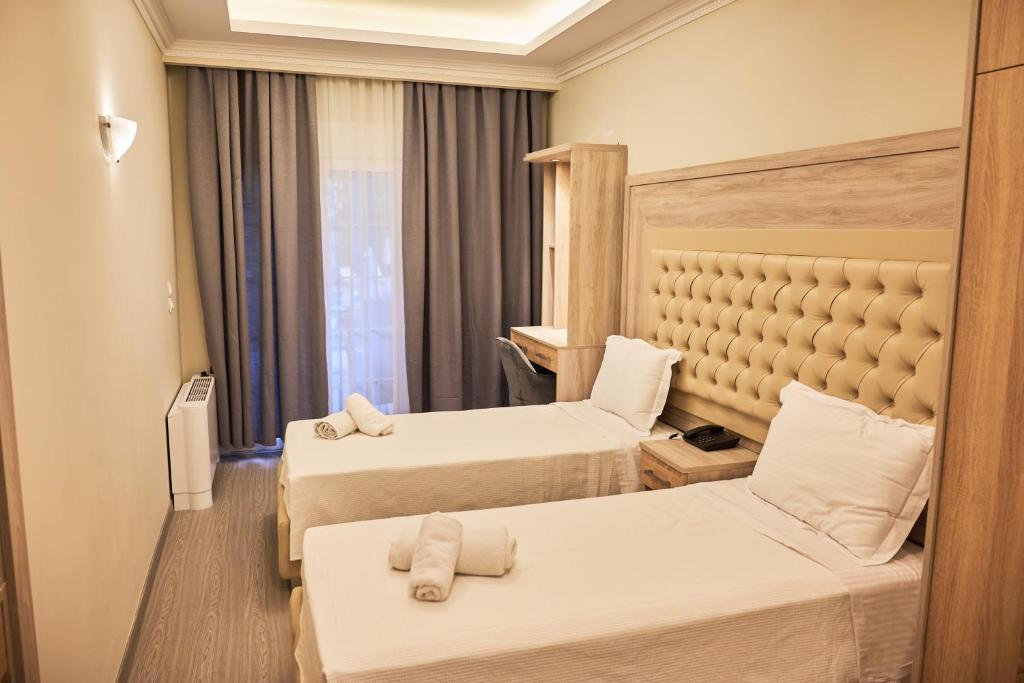 Posteľ alebo postele v izbe v ubytovaní Famissi Eden Hotel