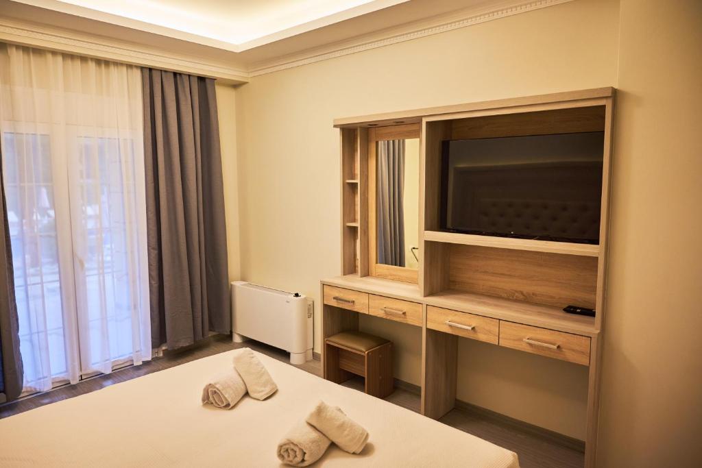 Posteľ alebo postele v izbe v ubytovaní Famissi Eden Hotel