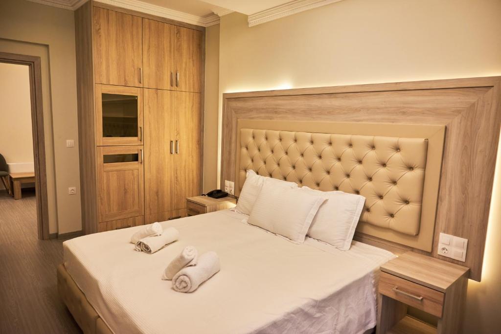 Posteľ alebo postele v izbe v ubytovaní Famissi Eden Hotel