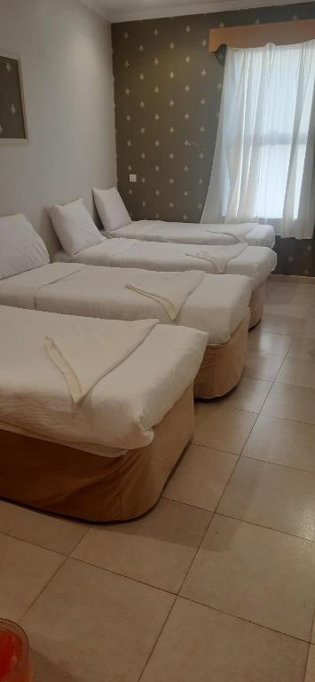 Postel nebo postele na pokoji v ubytování فندق رايد
