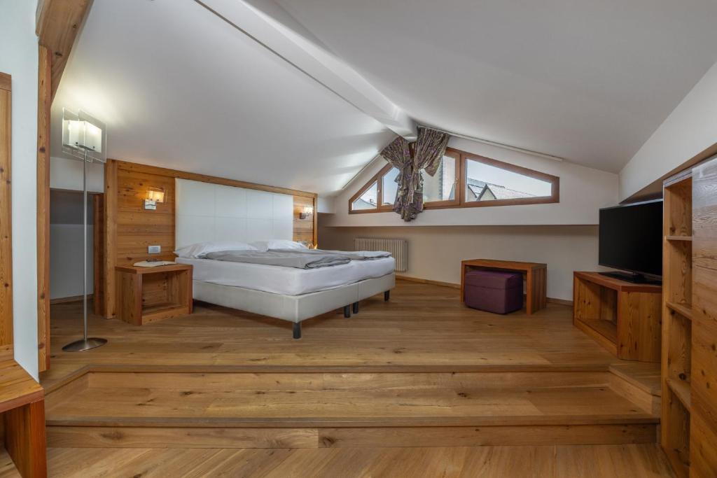 Postel nebo postele na pokoji v ubytování Albergo Tuenno