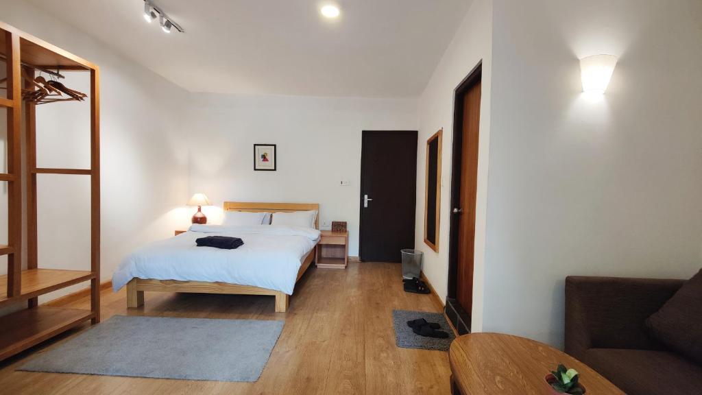 Postel nebo postele na pokoji v ubytování Nextdoor Kathmandu